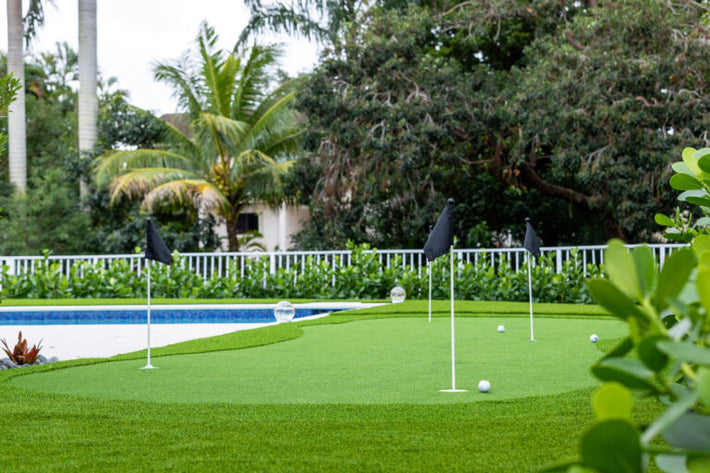 Custom putting green integrated into landscape design for a premium outdoor space in Miami