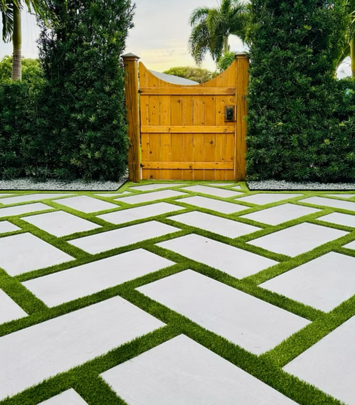Luxury landscape design with elegant plant layout and lighting in a Miami home