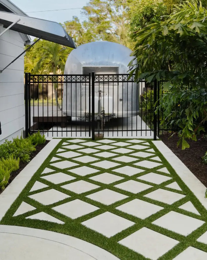 Custom outdoor living space designed with patio and greenery in Miami