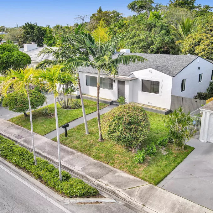 Front yard enhanced with colorful flower plantings for a refreshed look in Miami
