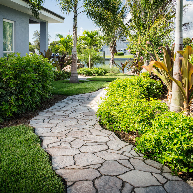 Stone walkway installed for enhanced curb appeal and function in a Miami front yard